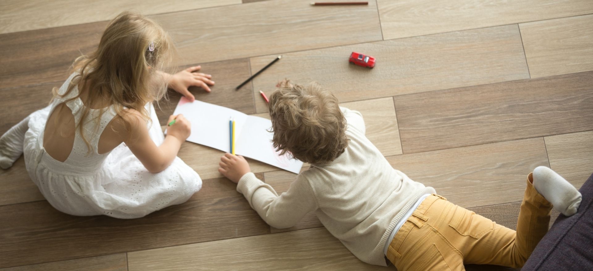 Kids on the floor drawing together