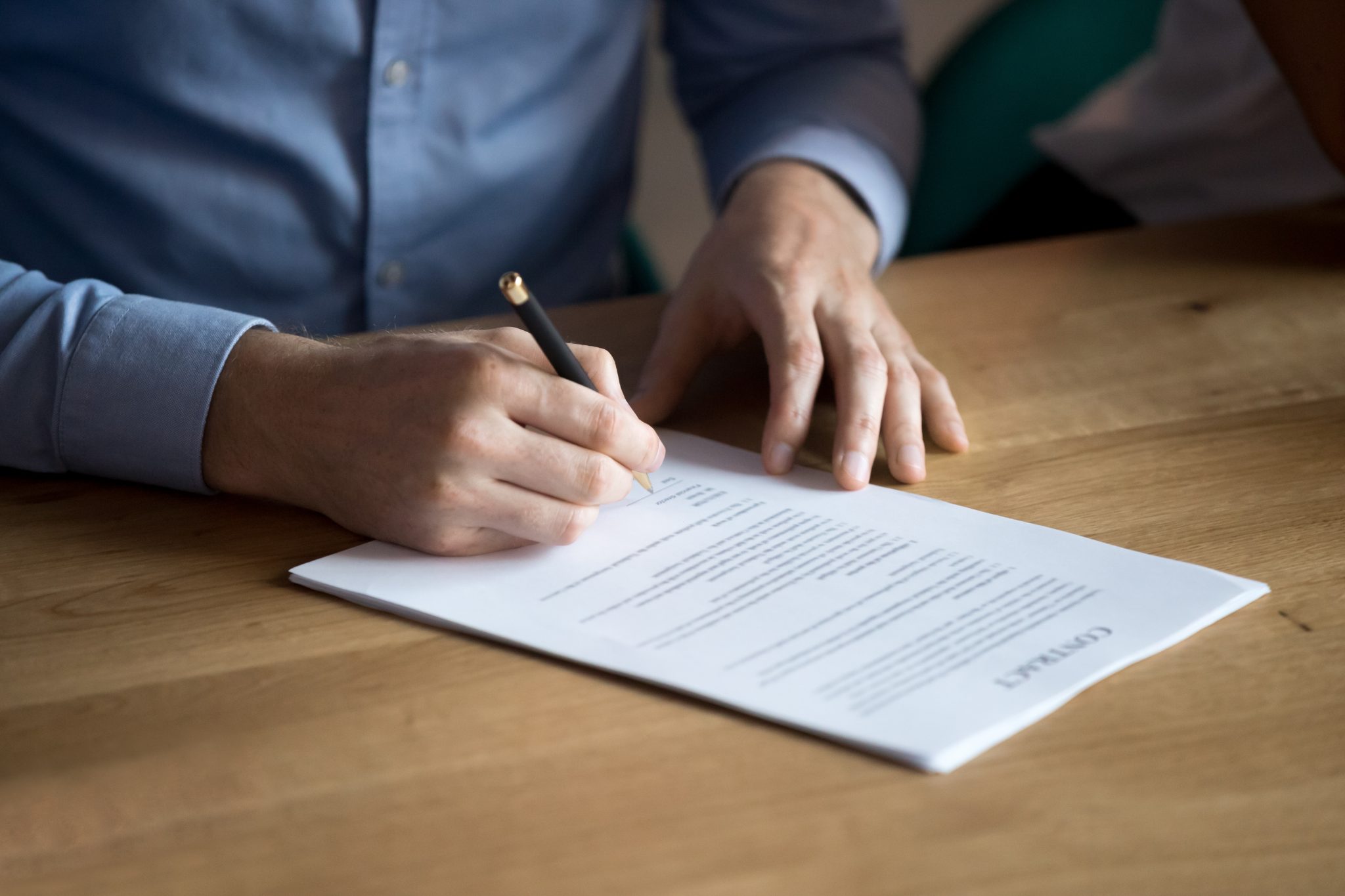 Man signing a testamentary trusts