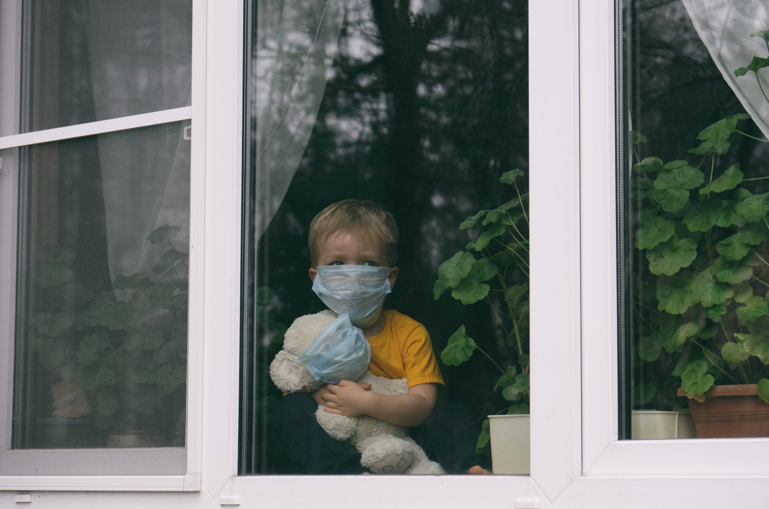 child looking outside with mask on