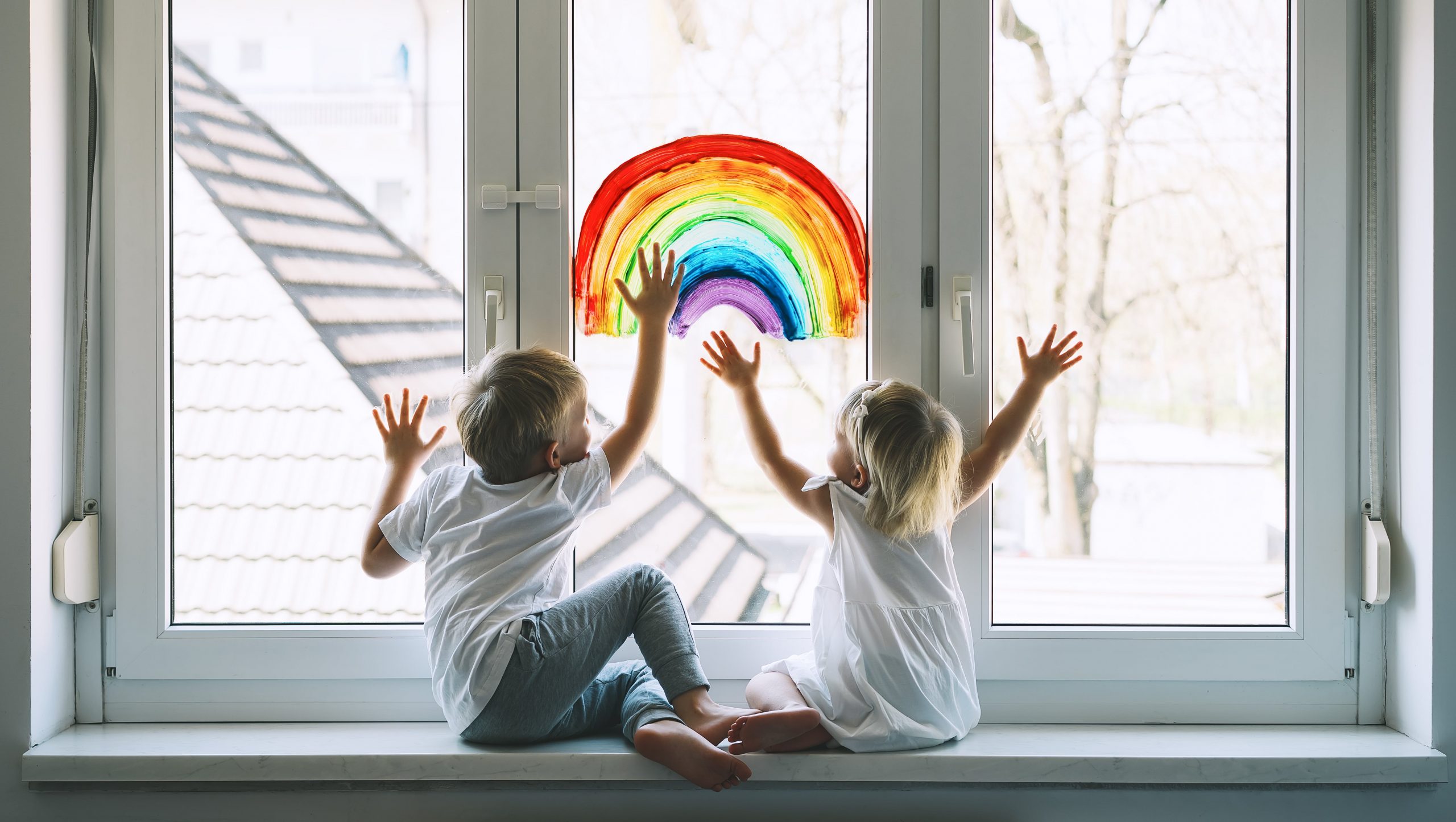 children with rainbow painting background